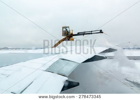 Moscow, Russia - December 11, 2018: Process Of De-icing The Aircraft Before The Flying In The Winter