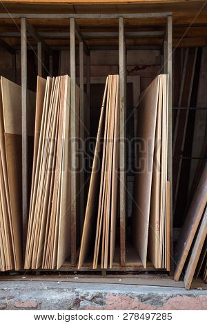 Large Rectanguler Wood Panels Stacked Up Together In Display