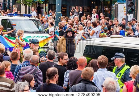 Vilnius, Lithuania - July 27, 2013: Pride Parade In Action. Crowd Of Watchers And Demonstrators With