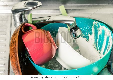 Dirty Dishes, Cups, Plates, Spoons In The Sink