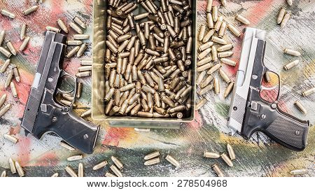 Top View Of Gun And Ammunition Box On The Table