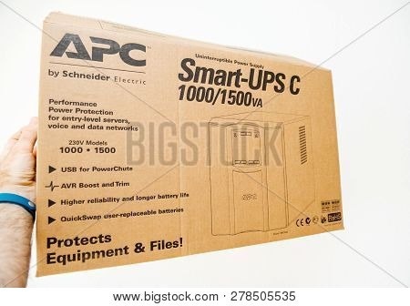 Paris, France - Mar 24, 2018: Pov Man Holding  New Apc Smart-ups C 1000va Lcd 230v Enterprise-level 