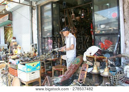 Tel Aviv, Israel - June 7, 2013: The Seller In The Shop On Flea Market In Old Yaffo, Tel Aviv, Israe