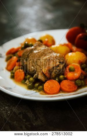 Beef meat stewed with potatoes-Traditional French cuisine Beef Bourguignon potatoes carrots in persillade