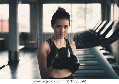 Female Boxer Is Training Punching In Fitness Gym.,portrait Of Boxing Woman Is Practicing Footwork In