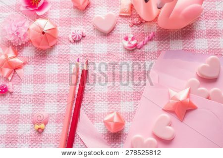 Letter Love And Valentine's Day Decoration On Pink Tablecloth Texture Background.