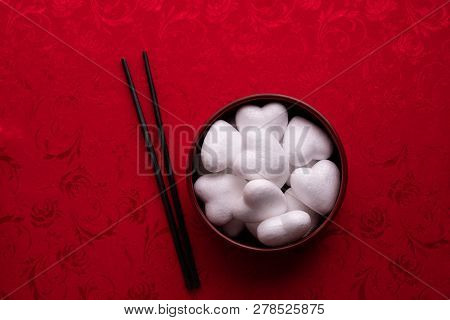 White Heart Shape On Plate With Red Background, Valentine's Day Holiday Celebration.