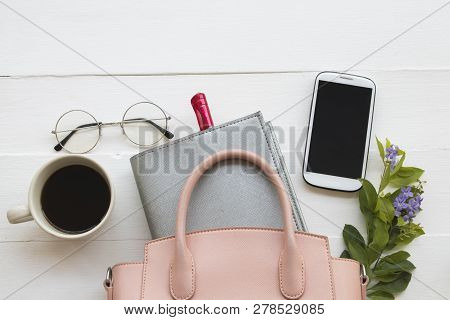 Notebook Planner ,mobile Phone ,hot Coffee And Pink Hand Bag Of Lifestyle Working Woman For Business