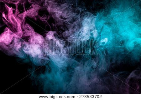 Thick Blue And Purple Smoke On A Black Isolated Background. Background From The Smoke Of Vap