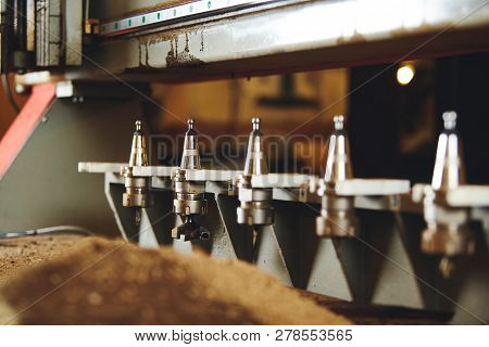 Machine With Numerical Control For Cutting Wood With Various Router Bits.