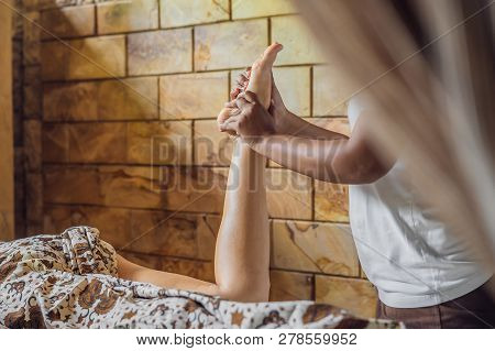 Total Relaxation. Beautiful Young Wwoman Get Balinese Or Thai Massage
