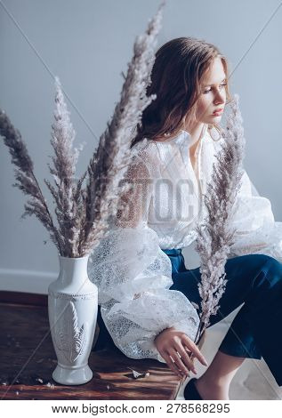 Portrait Of Beautiful Young Brunette Girl With Makeup  In Fashion Clothes