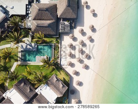 Aerial View Of Amazing Tropical White Sandy Beach With Palm Leaves Umbrellas And Turquoise Sea, Maur