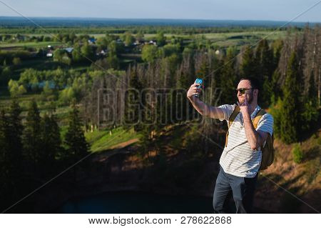 Handsome Man Shooting Selfie In The Nautre. Hiking Trip. Mountaineering Moments. Shooting Beautiful 