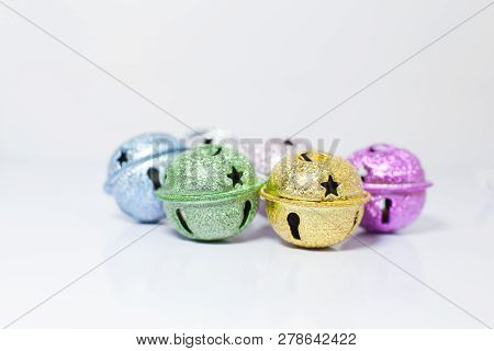 Group Of Colorful Painted Pet Small Bells For Cats And Dogs On White Background. Pet Shopping Produc