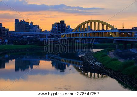 Songshan District Sunset Cityscape In Taipei. River Skyline Reflection.