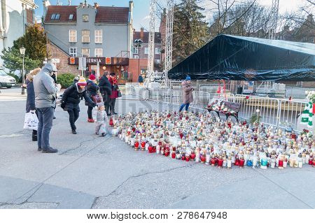 Gdansk, Poland - January 15, 2019: People And Lots Of Candles After Pawel Adamowicz Death. Pawel Ada