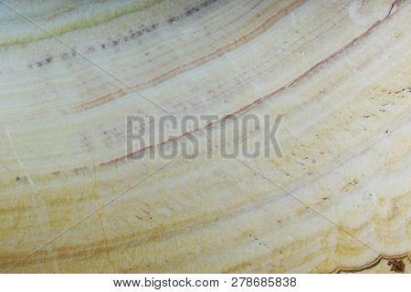 A Piece Of Natural Onyx Stone With A White Pattern Is Called Onice Arco Iris