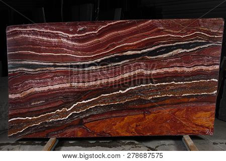 A Large Plate Of Natural Stone Of Red Color With Beautiful Stripes Is Called Onice Fantastico