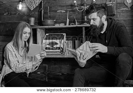 Soulful Evening Concept. Girl And Man On Calm Faces Reading Book In Warm Atmosphere. Father Instills