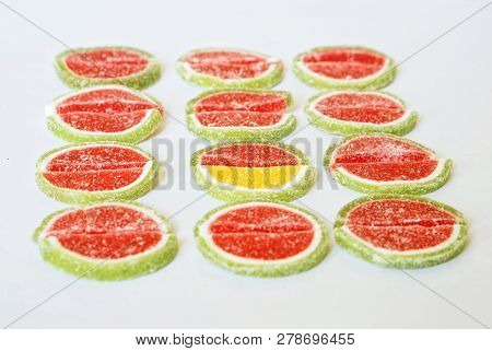 Marmalade Slices In The Form Of Watermelon And Lime On A White Background. Stand Out From The Crowd: