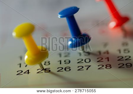 Embroidered Blue Pins On A Calendar On The 25th With Selective Focus