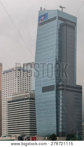 Hong Kong Island, China  - May 14, 2010: Greenish Aia Group Office Headquarters Building Against Sil