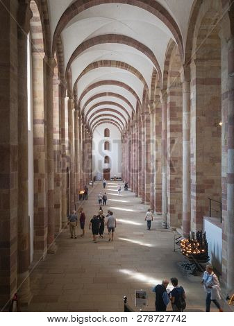Speyer, Germany - August 17, 2017: Interior Of Speyer Cathedral With Its Side Aisle And Some Visitor