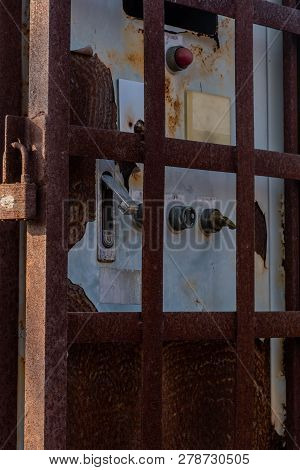 Old Disused Electrical Switch Box With Signs Of Damage Inside A Rusty Metal Utility Box Security Cag