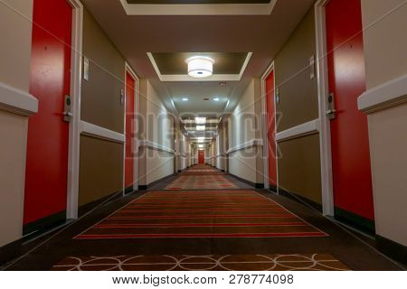 POV of walking in long corridor at a hotel