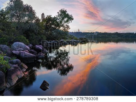 Beautiful Tranquil Summer Nature Landscape - River With Rocky Coastline, Blue Sky And Clouds, Colore