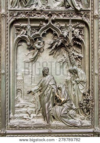 Detail Bronze Bas-reliefs Of The Pieta Scene In Bas Relief At Milan's Cathedral Doors