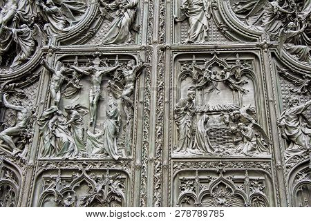 Detail Bronze Bas-reliefs Of The Pieta Scene In Bas Relief At Milan's Cathedral Doors