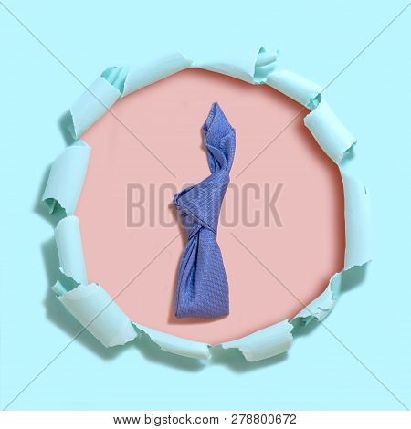 Homemade Easter Bunny Made Of Blue Napkin. Pink Background Under Tattered Light Blue Paper With Hole