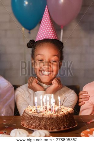Happy Girl In Party Hat With Birthday Cake, Making Wish