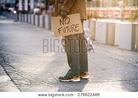 A Midsetion Of Homeless Beggar Man Standing Outdoors On A Road, Holding A Bag. Copy Space.