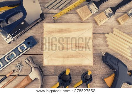 Set Of Construction Tools On A White Wooden Plank, Directly Above. Copy Space For Your Text.