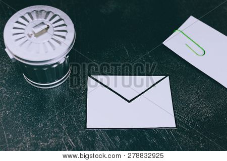 Envelope With Clip Symbol Of Email And Attachments With Trash Can Next To It
