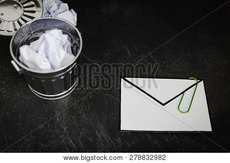 Envelope With Clip Symbol Of Email And Attachments With Trash Can Next To It