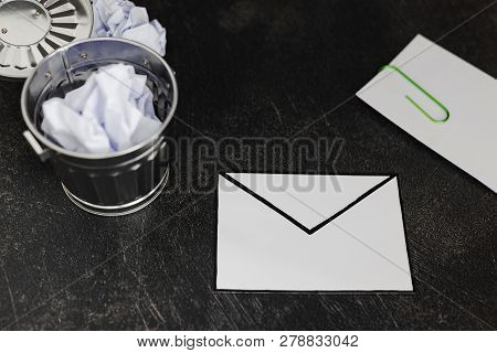Envelope With Clip Symbol Of Email And Attachments With Trash Can Next To It