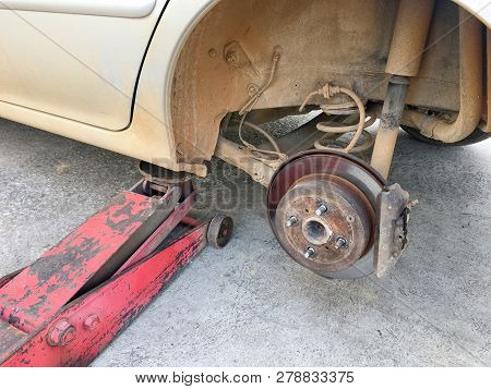 Photo Of An Old Are Parks In The Garage Waiting For Change A New Tyre In Local Garage Of Thailand Co