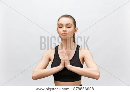 Lotus Pose, Yoga Hands Close Up. Yoga Woman In White Sport Clothes Meditation. Young Woman Relax And