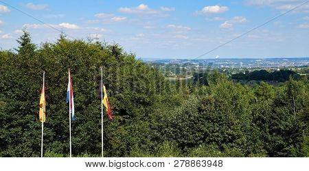 Flags From Netherlands, Belgium And Germany On Three Country Border