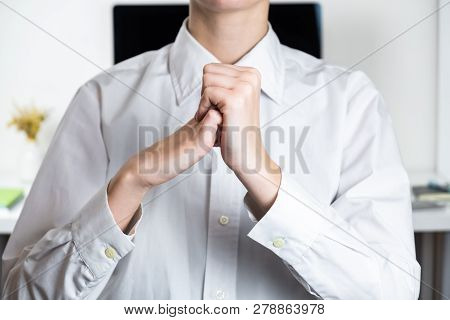 Stretching Arms In Sparse Office Workplace. Hands Of An Employee In Front Of Modern Desktop, Tired O