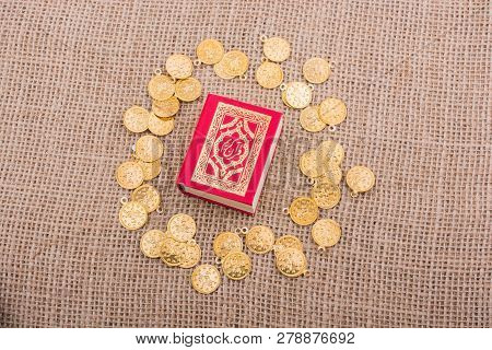 Fake Gold Coins Around The Islamic Holy Book Quran