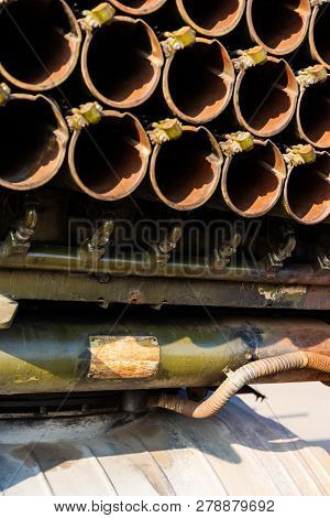 Camouflage Military Truck With Rocket Launcher. Outdoor Military Vehicles Museum. Armor Is Damaged A