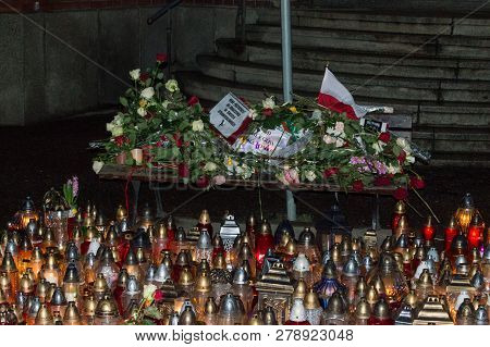 Gdansk, Poland - January 16, 2019: Bench With Flowers After Pawel Adamowicz Death At Night. Pawel Ad