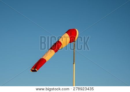 Windsock On Blue Sky Background On A Sunny Day