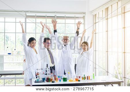 Scientists Team Raise Up Your Hand,group Of People Teamwork In Laboratory,successful And Reserch Wor