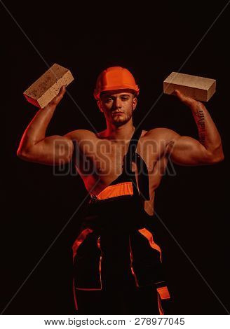 Building Up Great Things. Construction Worker Or Builder At Work At Building Site. Bricklayer Worker